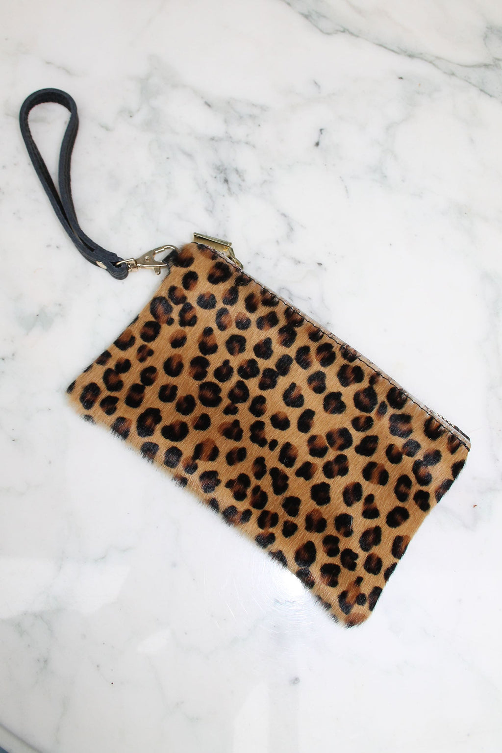 Absolème pochette en cuir motif léopard